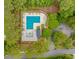Aerial view of community pool with surrounding landscaping, tables and seating at 19 Coventry Pl., Pawleys Island, SC 29585