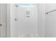 Walk-in shower featuring white subway tile, mosaic floor, and soap niches at 19 Coventry Pl., Pawleys Island, SC 29585