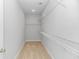 Walk-in closet with carpet floors and metal shelving at 19 Coventry Pl., Pawleys Island, SC 29585