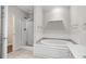 Modern bathroom featuring a glass-enclosed shower and separate soaking tub at 192 Berkshire Loop, Pawleys Island, SC 29585