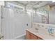 Cozy bathroom featuring a tub-shower combination with decorative wallpaper and vanity at 192 Berkshire Loop, Pawleys Island, SC 29585