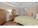 Comfortable bedroom showcasing wood floors, tray ceiling, and neutral tones with a traditional furniture set at 192 Berkshire Loop, Pawleys Island, SC 29585