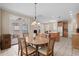 Dining room with wooden table, chairs, and a french door leading to the outside at 192 Berkshire Loop, Pawleys Island, SC 29585