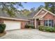 Well-maintained brick home with a two-car garage and manicured front yard at 192 Berkshire Loop, Pawleys Island, SC 29585