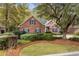 Charming red brick home with well-manicured lawn and lush landscaping at 192 Berkshire Loop, Pawleys Island, SC 29585