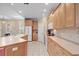 Well-appointed kitchen with an island, featuring modern appliances, light cabinets, and tile flooring at 192 Berkshire Loop, Pawleys Island, SC 29585
