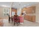 Bright kitchen featuring a center island, tile floors, and wood cabinets at 192 Berkshire Loop, Pawleys Island, SC 29585