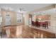 Open-concept living area with hardwood floors, fireplace, and kitchen access at 192 Berkshire Loop, Pawleys Island, SC 29585