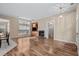 Bright living room with fireplace and windows, seamlessly connecting to other living spaces at 192 Berkshire Loop, Pawleys Island, SC 29585