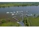 Scenic marina view with multiple boats docked and lush green surroundings at 192 Berkshire Loop, Pawleys Island, SC 29585