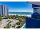 Breathtaking beach view framed by lush palms, with turquoise waters and a pristine sandy shore at 2001 S Ocean Blvd. # 621, Myrtle Beach, SC 29577