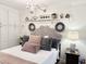 Charming bedroom with a tufted headboard, elegant chandelier, and stylish decor at 2001 S Ocean Blvd. # 621, Myrtle Beach, SC 29577