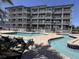 Exterior view of the condo with balconies, a pool, and a lazy river at 2001 S Ocean Blvd. # 621, Myrtle Beach, SC 29577