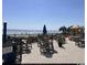 Patio area with multiple picnic tables and chairs with an ocean view at 2001 S Ocean Blvd. # 621, Myrtle Beach, SC 29577