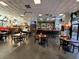 Busy restaurant with tables, chairs, bar area and TVs with bar top seating visible at 2001 S Ocean Blvd. # 621, Myrtle Beach, SC 29577