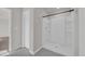 Clean bathroom features a walk-in shower with decorative tile flooring and crisp, white walls at 204 Leaflet Loop, Pawleys Island, SC 29585