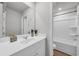 Bathroom with double sinks and a view of a tub and shower at 204 Leaflet Loop, Pawleys Island, SC 29585