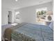 Cozy bedroom featuring carpet floors, a ceiling fan, two windows and baseboard molding at 204 Leaflet Loop, Pawleys Island, SC 29585