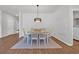 Dining room with wood floors, a pendant light, and a table with chairs ready for entertaining at 204 Leaflet Loop, Pawleys Island, SC 29585