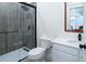 Modern bathroom features a tiled shower, toilet, and a vanity sink at 224 Oak Bay Dr., Georgetown, SC 29440
