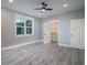 Well-lit bedroom features a large window, hardwood floors, and a walk-in closet at 224 Oak Bay Dr., Georgetown, SC 29440