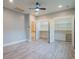 Empty bedroom with walk-in closets, hardwood floors, and a ceiling fan at 224 Oak Bay Dr., Georgetown, SC 29440