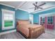 Inviting bedroom with water view features a king-size bed, neutral colors, and natural light at 224 Oak Bay Dr., Georgetown, SC 29440
