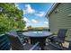 A scenic view from the deck with a round table and chairs overlooking marsh views at 224 Oak Bay Dr., Georgetown, SC 29440