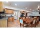 Spacious dining area with a large table, wood floors, kitchen area and natural light at 224 Oak Bay Dr., Georgetown, SC 29440