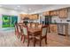 Eat-in kitchen features a dining table, wood cabinets, and stainless steel appliances at 224 Oak Bay Dr., Georgetown, SC 29440