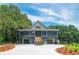 Inviting two-story home with a spacious porch, double garages and a well-maintained yard, perfect for families at 224 Oak Bay Dr., Georgetown, SC 29440