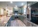 Well-equipped kitchen with stainless steel appliances, granite counters, and ample cabinet space; modern design at 224 Oak Bay Dr., Georgetown, SC 29440