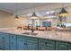 Modern kitchen with a large island, granite countertops, and pendant lighting, ideal for cooking and entertaining at 224 Oak Bay Dr., Georgetown, SC 29440