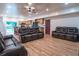 Spacious living room features wood floors, recessed lighting, and leather couches at 224 Oak Bay Dr., Georgetown, SC 29440
