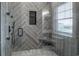 Luxurious tiled shower with built-in bench and rainfall showerhead at 224 Oak Bay Dr., Georgetown, SC 29440