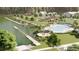 Community pool and dock featuring seating, a pier, and a lush green backdrop at 246 River Edge Dr., Myrtle Beach, SC 29588