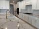 Modern kitchen featuring white cabinets, a marble countertop island, and stainless steel appliances at 246 River Edge Dr., Myrtle Beach, SC 29588