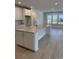 Spacious kitchen with large marble island, white cabinets, and modern gold fixtures at 246 River Edge Dr., Myrtle Beach, SC 29588