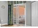 Balcony with sliding glass doors, curtains, and outdoor seating at 2801 S Ocean Blvd. # 231, North Myrtle Beach, SC 29582