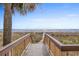 Beach access through a wooden boardwalk with a view of the ocean at 2801 S Ocean Blvd. # 231, North Myrtle Beach, SC 29582