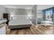 Well-lit bedroom that flows into the living area, featuring a queen-sized bed and ocean-themed decor at 2801 S Ocean Blvd. # 231, North Myrtle Beach, SC 29582