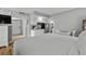 Bright bedroom featuring a queen-sized bed, kitchenette and a view of the entry door at 2801 S Ocean Blvd. # 231, North Myrtle Beach, SC 29582