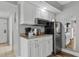 Kitchenette featuring granite counters, white cabinetry, and stainless steel appliances at 2801 S Ocean Blvd. # 231, North Myrtle Beach, SC 29582