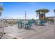 Outdoor patio area with dining tables and chairs at 2801 S Ocean Blvd. # 231, North Myrtle Beach, SC 29582