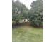 Lush backyard with mature trees offering privacy and a glimpse of a picnic area for outdoor enjoyment at 4639 Wild Iris Dr. # 43-204, Myrtle Beach, SC 29577