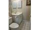 Cozy bathroom features tiled floors, mirrored vanity, and convenient toilet paper holder at 4639 Wild Iris Dr. # 43-204, Myrtle Beach, SC 29577