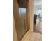 Shower with bronze frame and gray mat; tiled floors lead to the living area at 4639 Wild Iris Dr. # 43-204, Myrtle Beach, SC 29577
