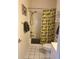 Clean, well-lit bathroom featuring white tiles, shower with updated fixtures, and coordinating vanity at 4639 Wild Iris Dr. # 43-204, Myrtle Beach, SC 29577