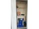 Open utility closet on porch filled with beach chairs, toys, and storage shelves at 4639 Wild Iris Dr. # 43-204, Myrtle Beach, SC 29577