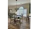 Dining area with laminate flooring adjacent to the living space and kitchen at 4639 Wild Iris Dr. # 43-204, Myrtle Beach, SC 29577